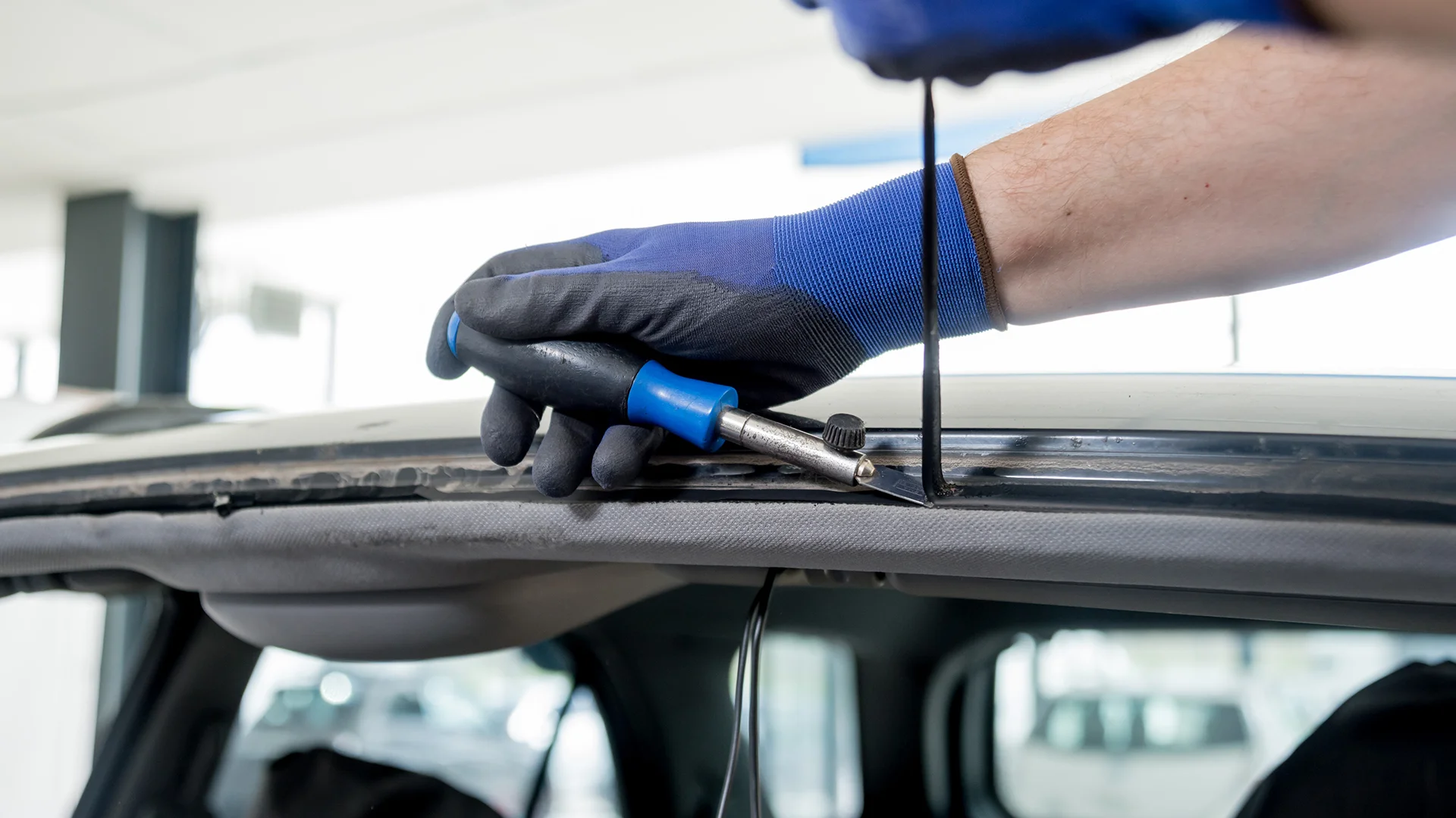 workers remove old windscreen
